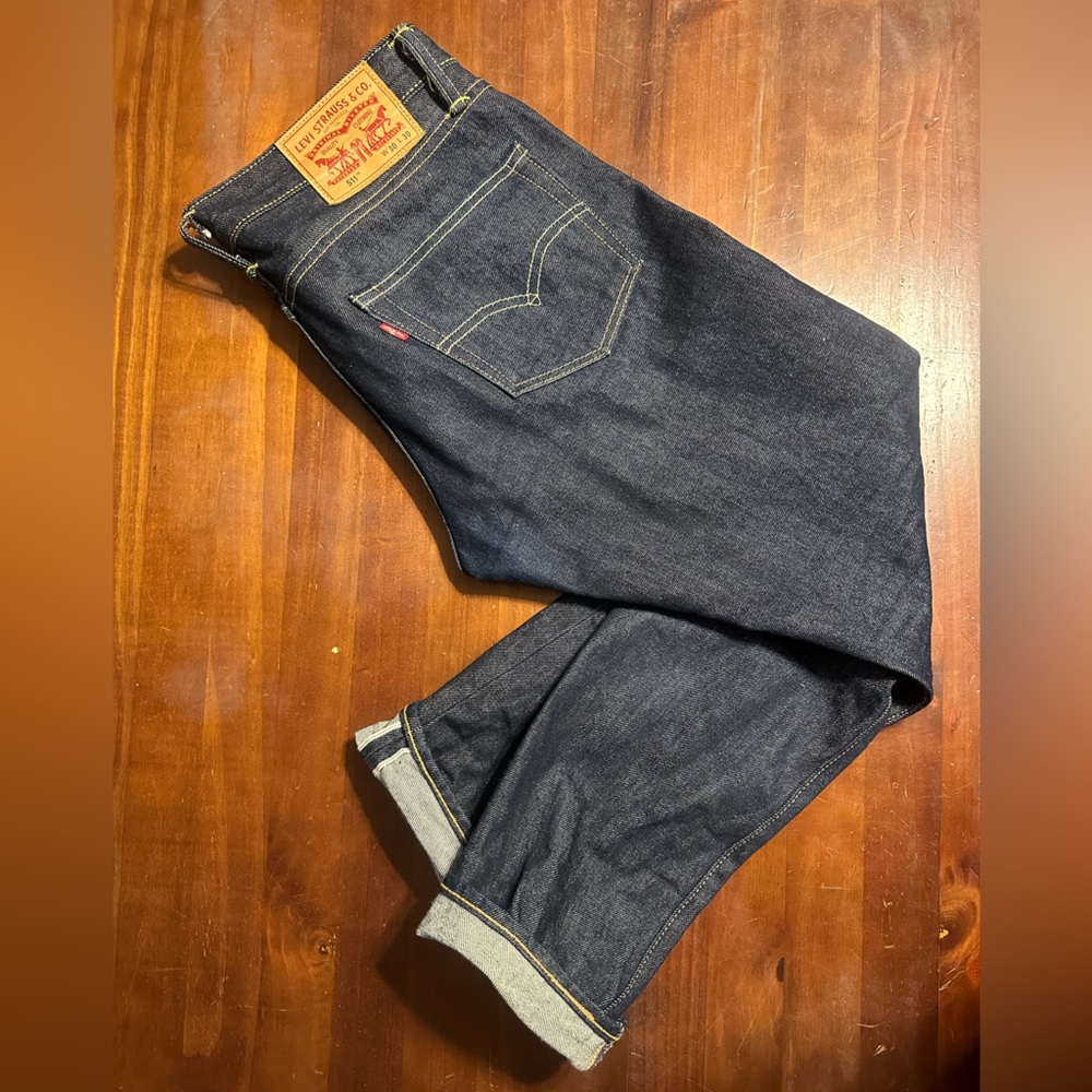 Raw denim Levi’s jeans.